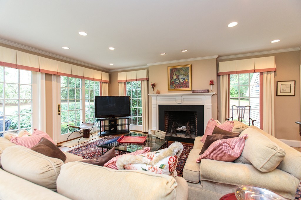 100 Hundreds Road Wellesley, MA 02481 - Photo 3 of 17 a living room with furniture and a fireplace
