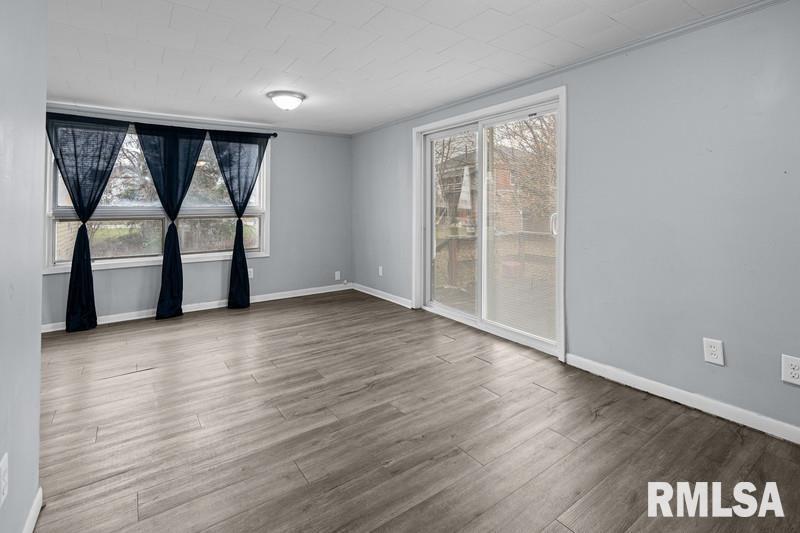 2629 170th Avenue Preemption, IL 61276 - Photo 11 of 21 wooden floor in an empty room with a window