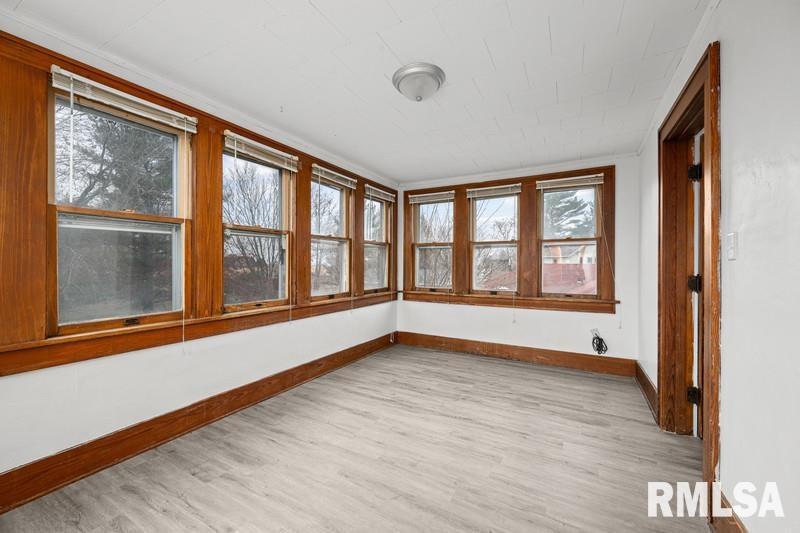 2629 170th Avenue Preemption, IL 61276 - Photo 18 of 21 a view of an empty room with a window and wooden floor