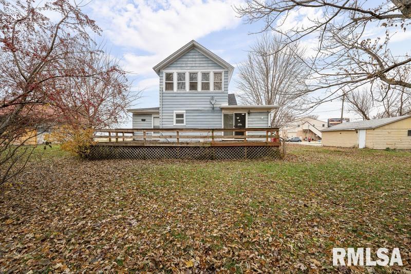 2629 170th Avenue Preemption, IL 61276 - Photo 20 of 21 a front view of a house with a yard covered with snow and trees
