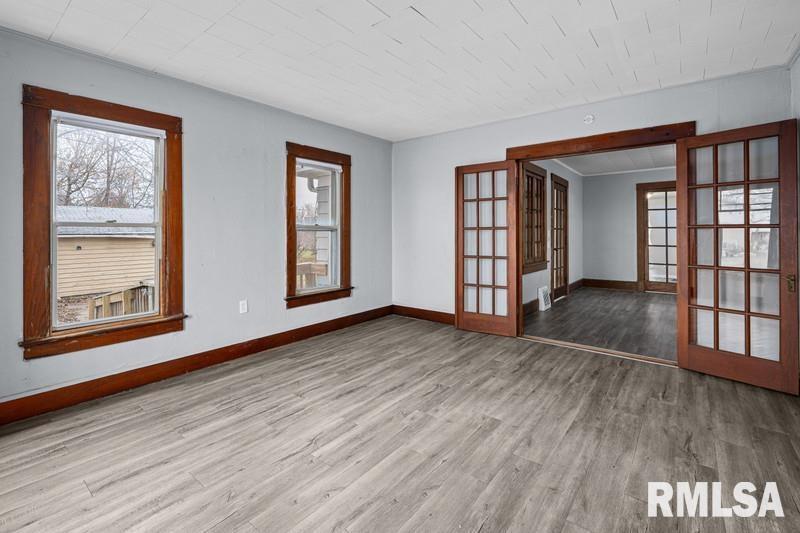 2629 170th Avenue Preemption, IL 61276 - Photo 3 of 21 a view of an empty room with wooden floor and a window