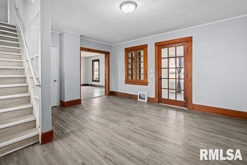 2629 170th Avenue Preemption, IL 61276 - Photo 6 of 21 a view of an empty room with wooden floor and a window