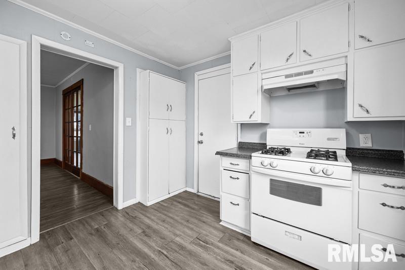 2629 170th Avenue Preemption, IL 61276 - Photo 8 of 21 a kitchen with white cabinets and white appliances
