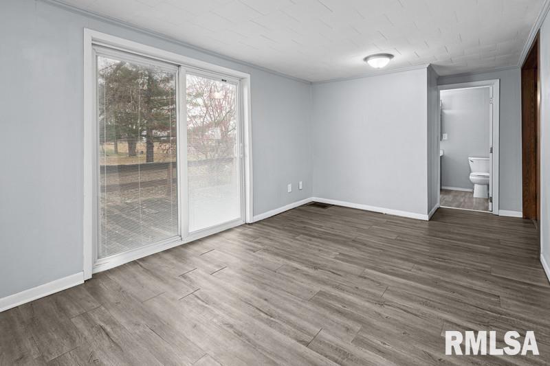 2629 170th Avenue Preemption, IL 61276 - Photo 10 of 21 wooden floor in an empty room with a window