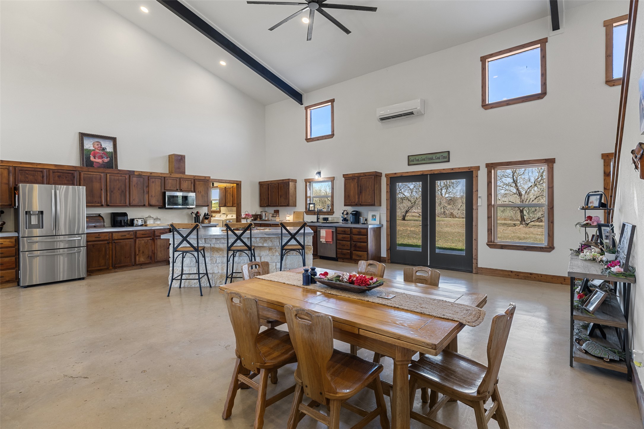 664 Martindale Falls Road Martindale, TX 78655 - Photo 2 of 21 Spacious open-concept interior featuring high vaulted ceilings with exposed beams, recessed lighting, and a ceiling fan