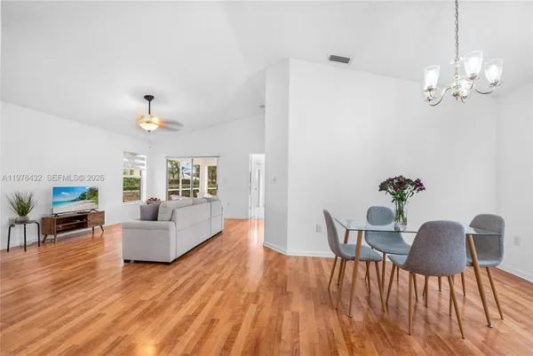a view of a livingroom with furniture and wooden floor