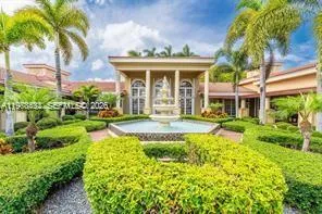 a view of a house with swimming pool and garden
