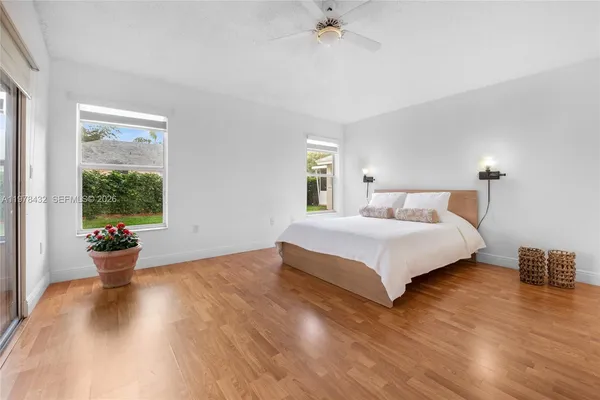 a bedroom with a large bed and a window