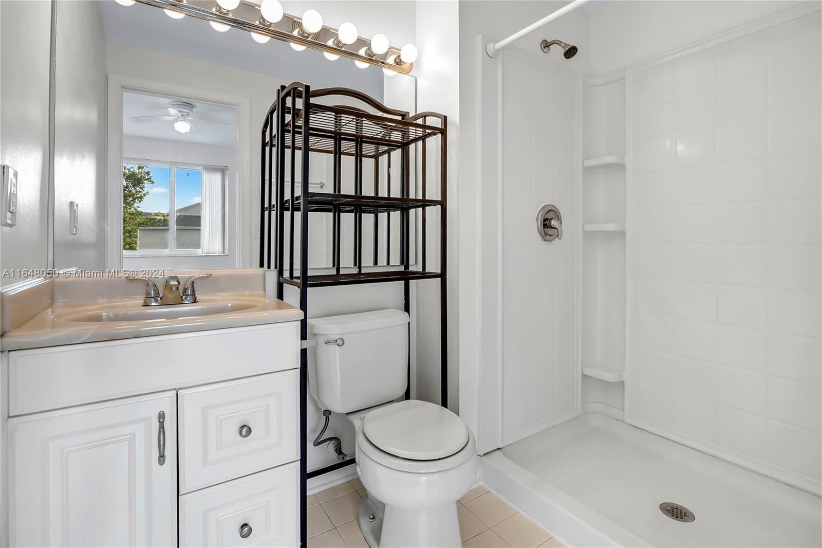 56 Truman Drive Weston, FL 33326 - Photo 18 of 24 a bathroom with a sink toilet and shower