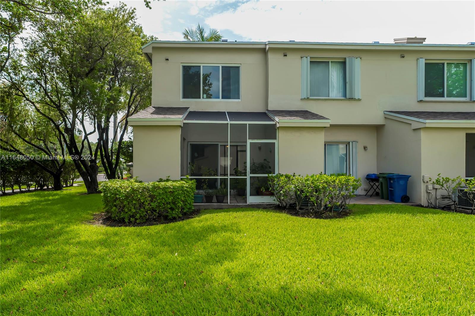 56 Truman Drive Weston, FL 33326 - Photo 23 of 24 a front view of a house with a garden