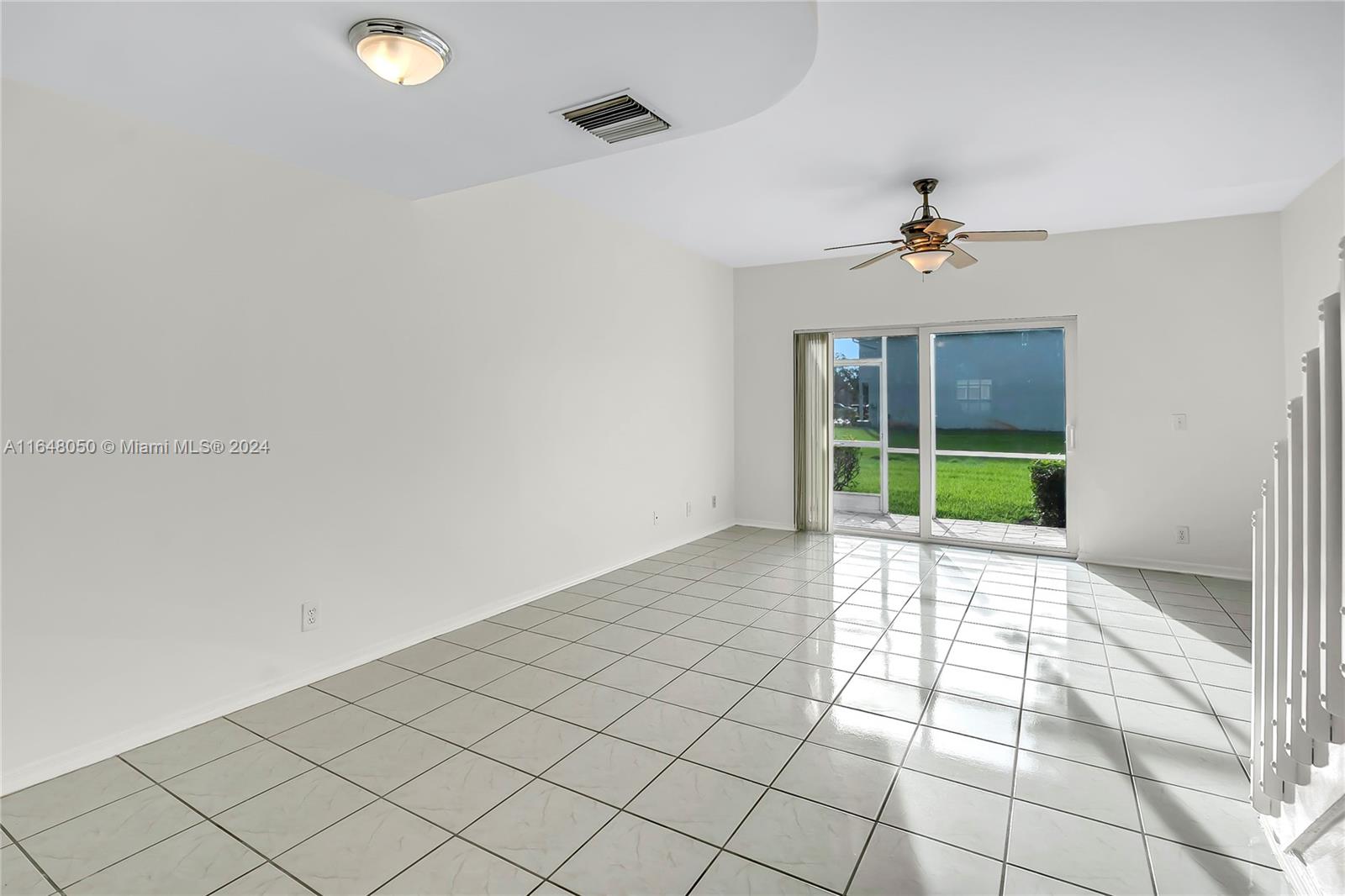56 Truman Drive Weston, FL 33326 - Photo 6 of 24 a view of an empty room and window