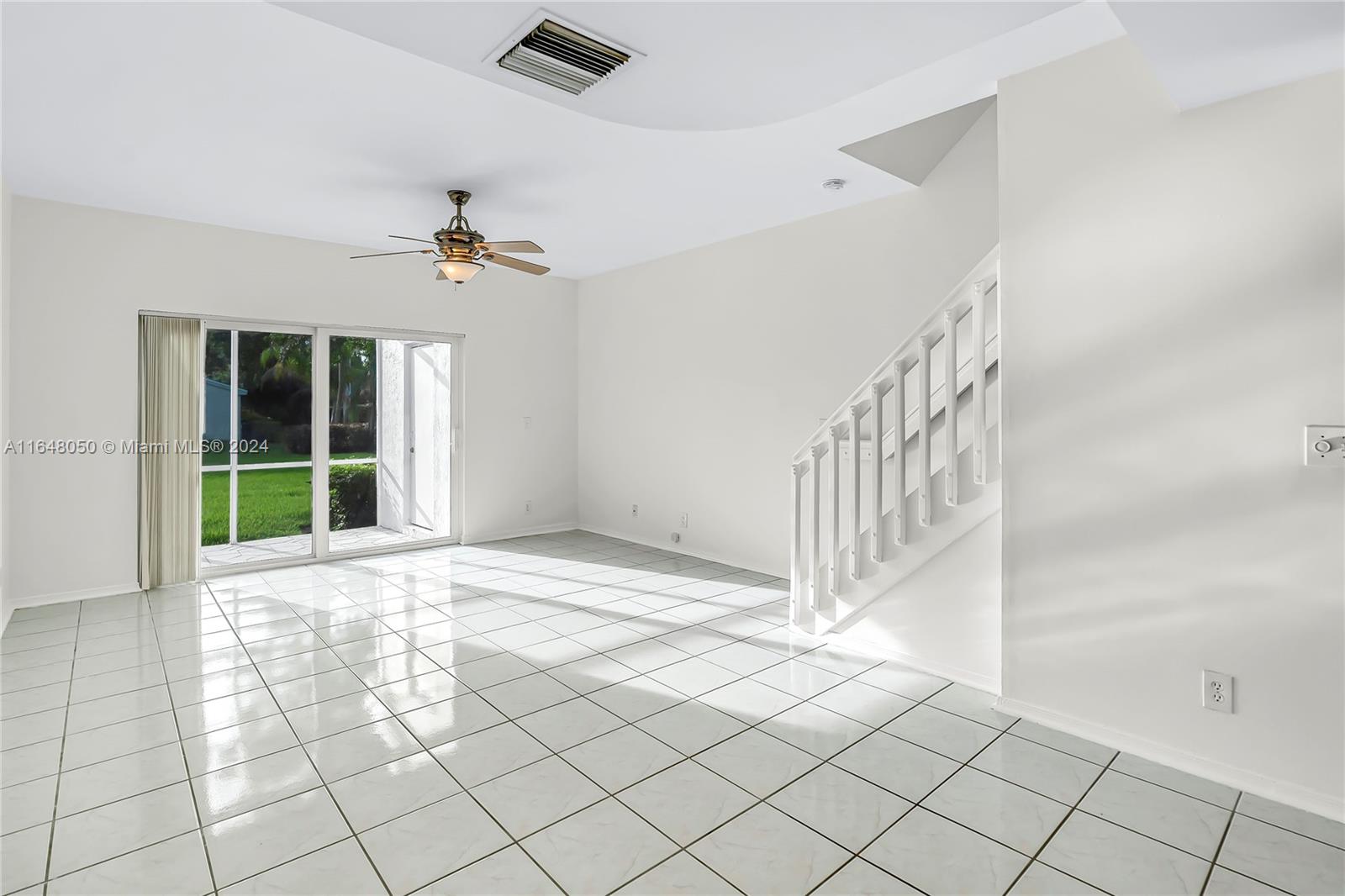 56 Truman Drive Weston, FL 33326 - Photo 7 of 24 a view of an empty room with a window