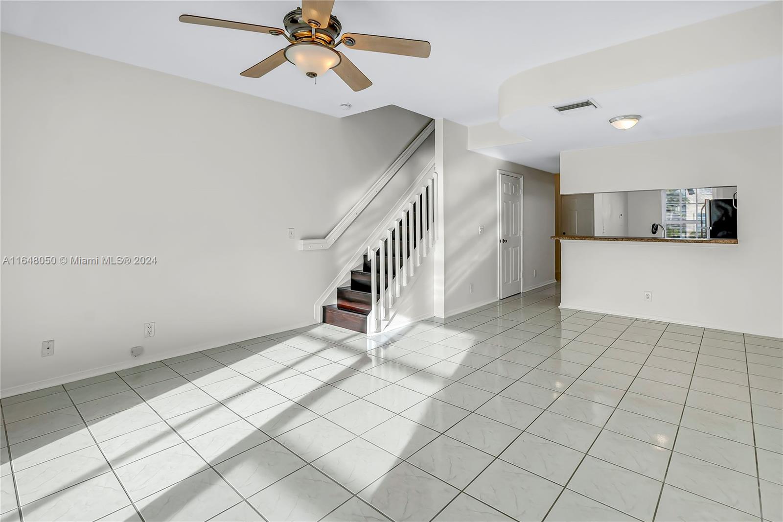 56 Truman Drive Weston, FL 33326 - Photo 8 of 24 a view of an empty room and stairs