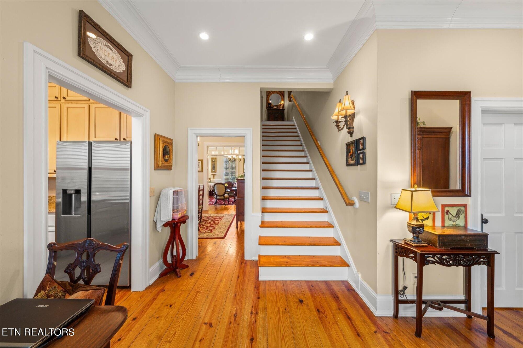 7016 Castlewood Road Knoxville, TN 37931 - Photo 21 of 58 a view of a hallway with wooden floor and windows