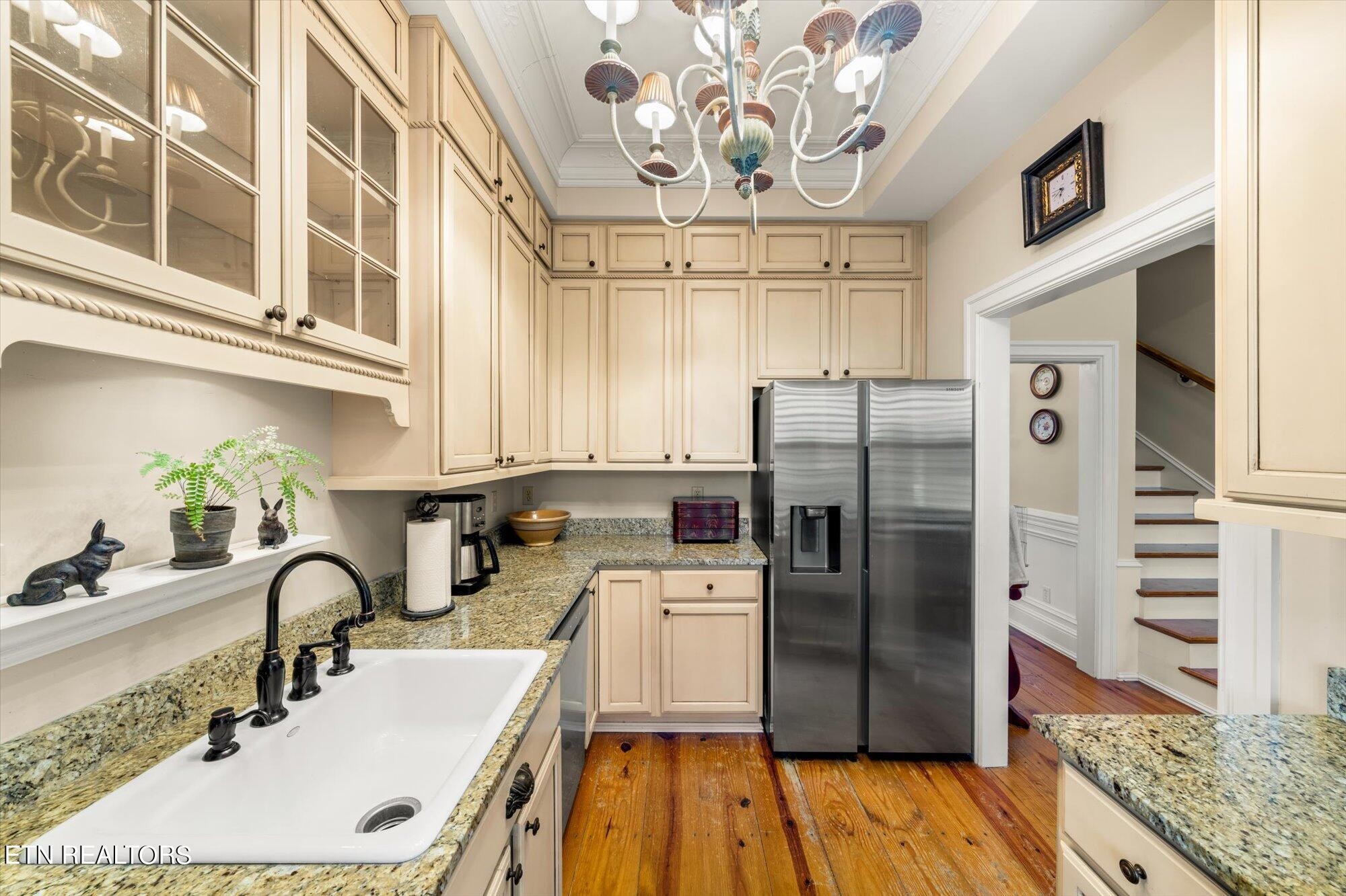 7016 Castlewood Road Knoxville, TN 37931 - Photo 26 of 58 a kitchen with stainless steel appliances a sink refrigerator and microwave