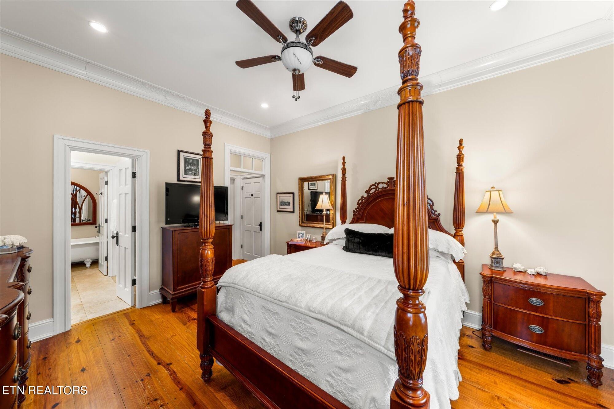 7016 Castlewood Road Knoxville, TN 37931 - Photo 30 of 58 a bedroom with a bed and a tv