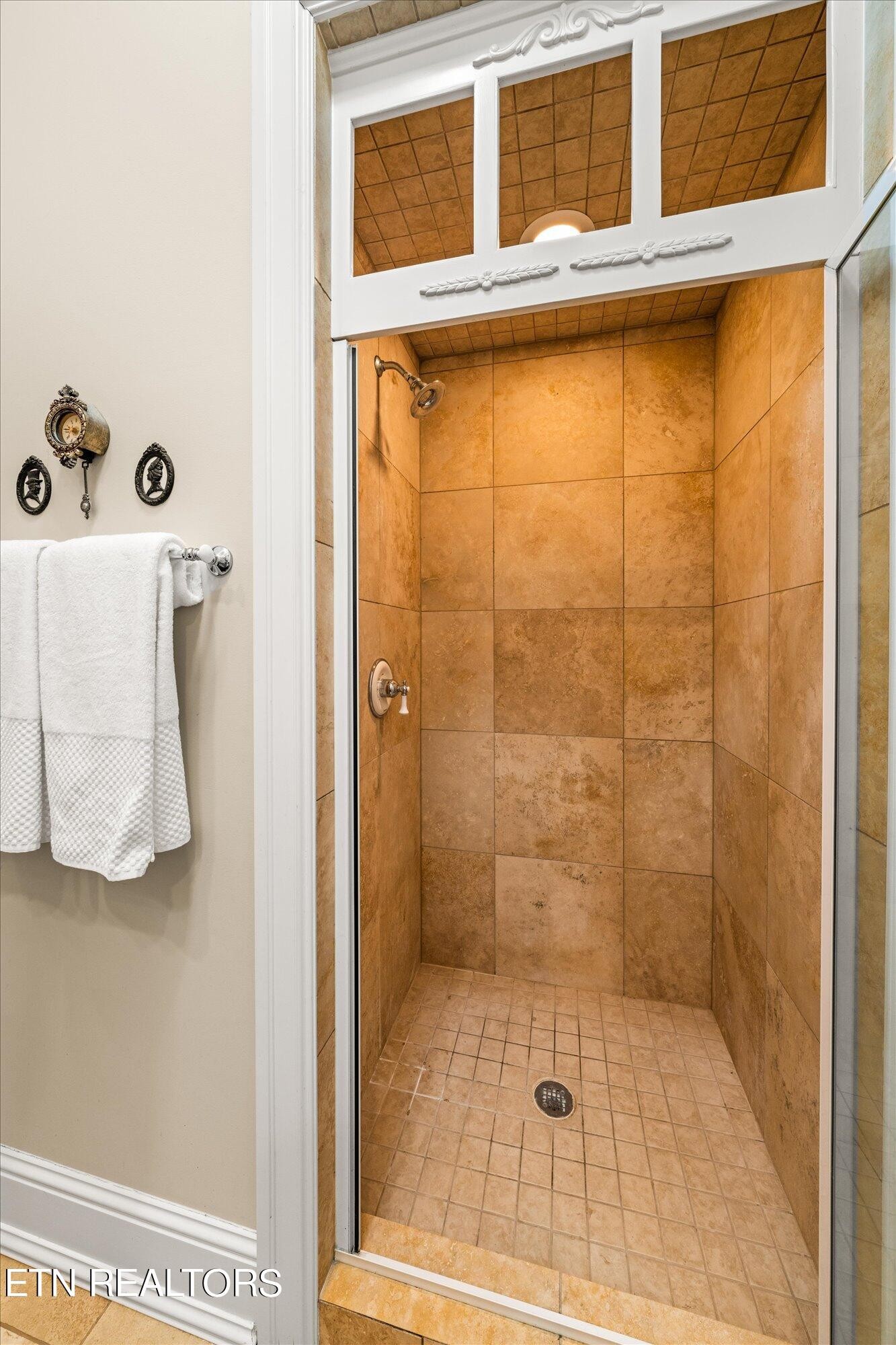 7016 Castlewood Road Knoxville, TN 37931 - Photo 33 of 58 a bathroom with a window and a shower