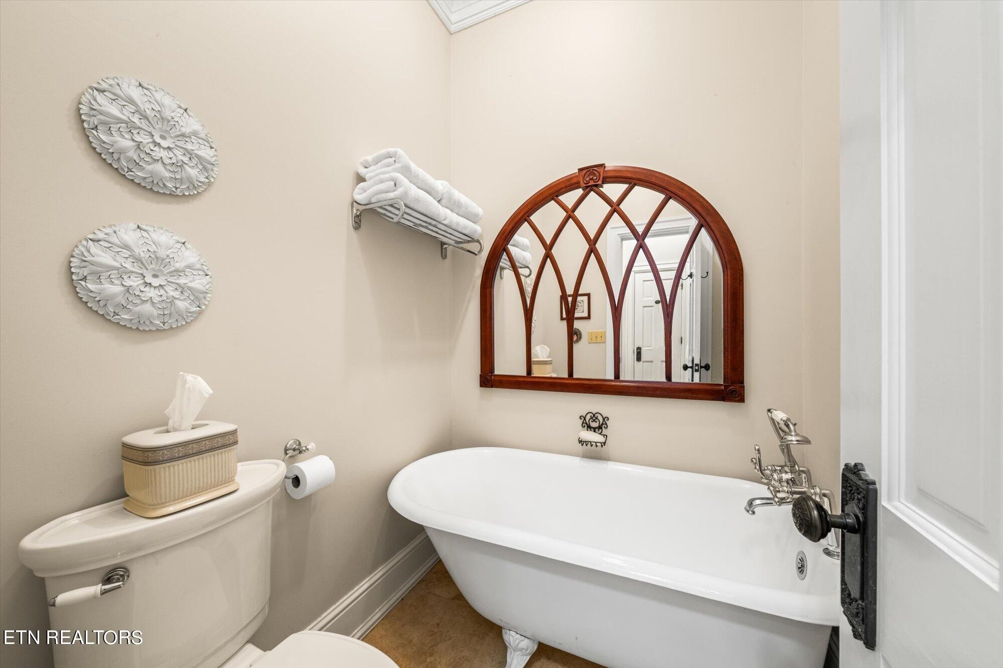 7016 Castlewood Road Knoxville, TN 37931 - Photo 34 of 58 a white bath tub sitting next to a white toilet