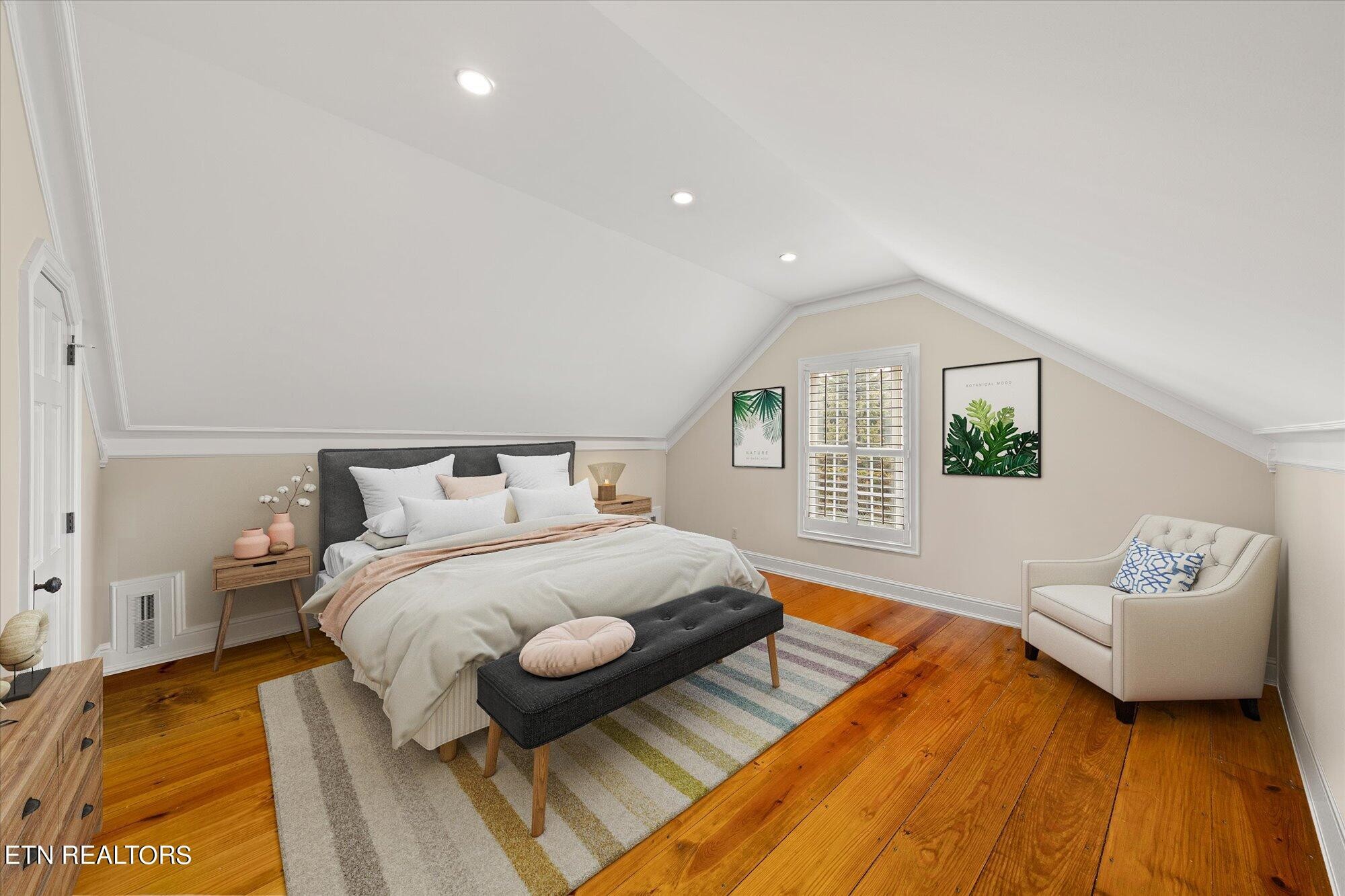 7016 Castlewood Road Knoxville, TN 37931 - Photo 39 of 58 a bedroom with a bed and wooden floor