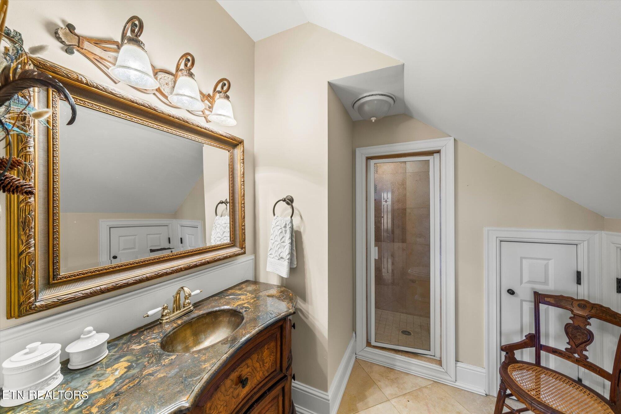 7016 Castlewood Road Knoxville, TN 37931 - Photo 41 of 58 a bathroom with a granite countertop sink and a mirror