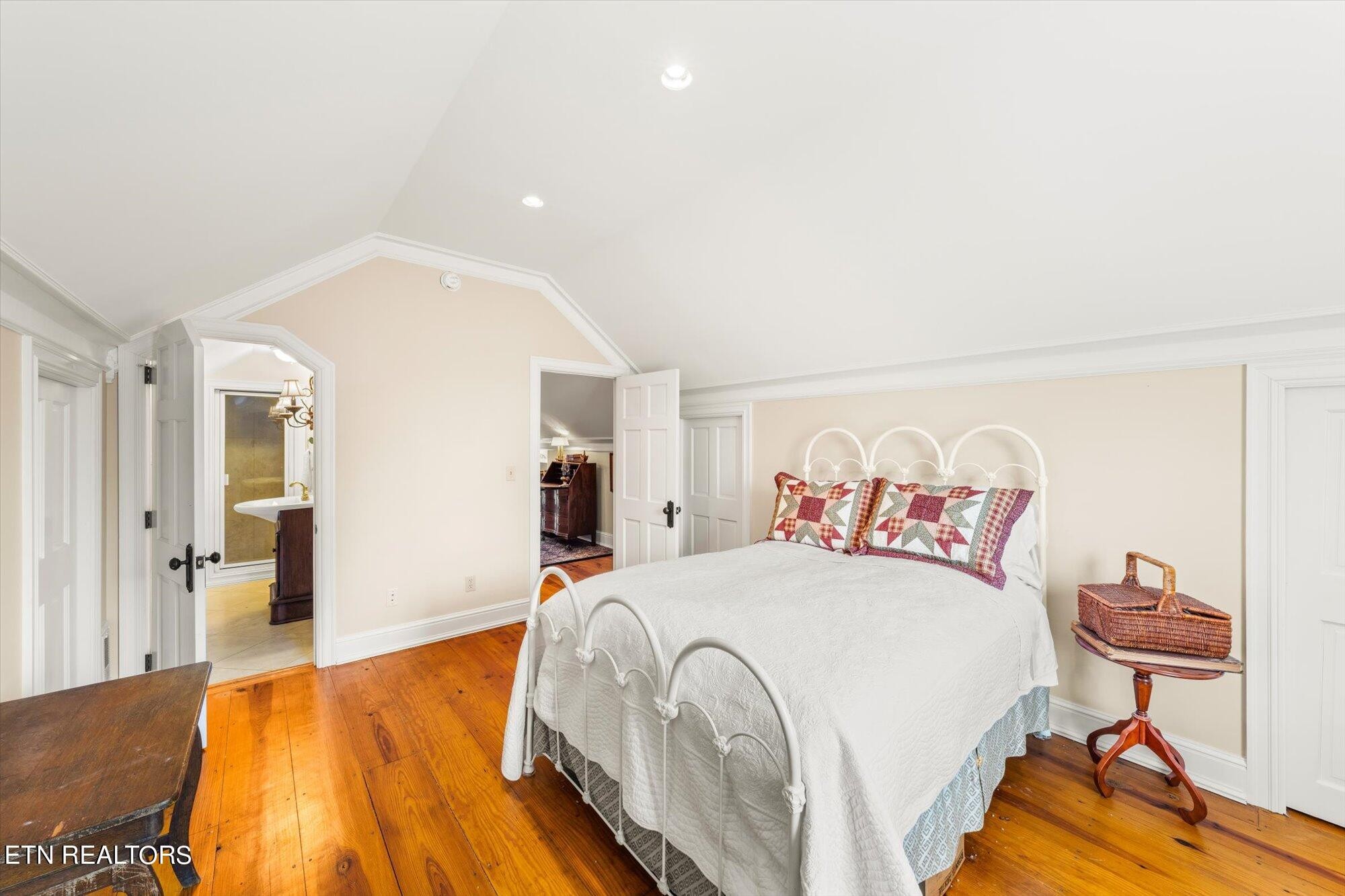 7016 Castlewood Road Knoxville, TN 37931 - Photo 43 of 58 a spacious bedroom with a bed and a couch