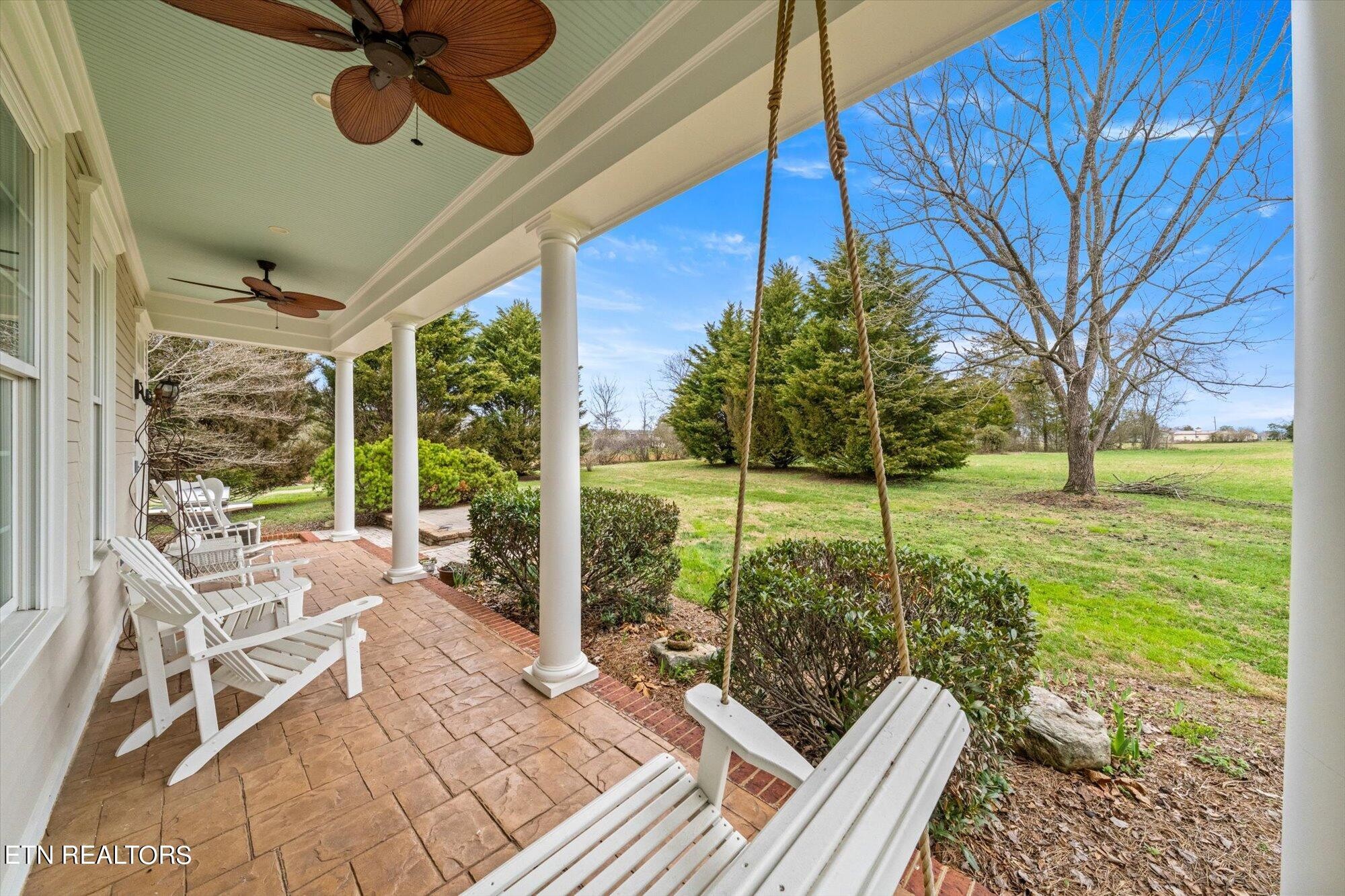 7016 Castlewood Road Knoxville, TN 37931 - Photo 51 of 58 a view of a porch with chairs and backyard