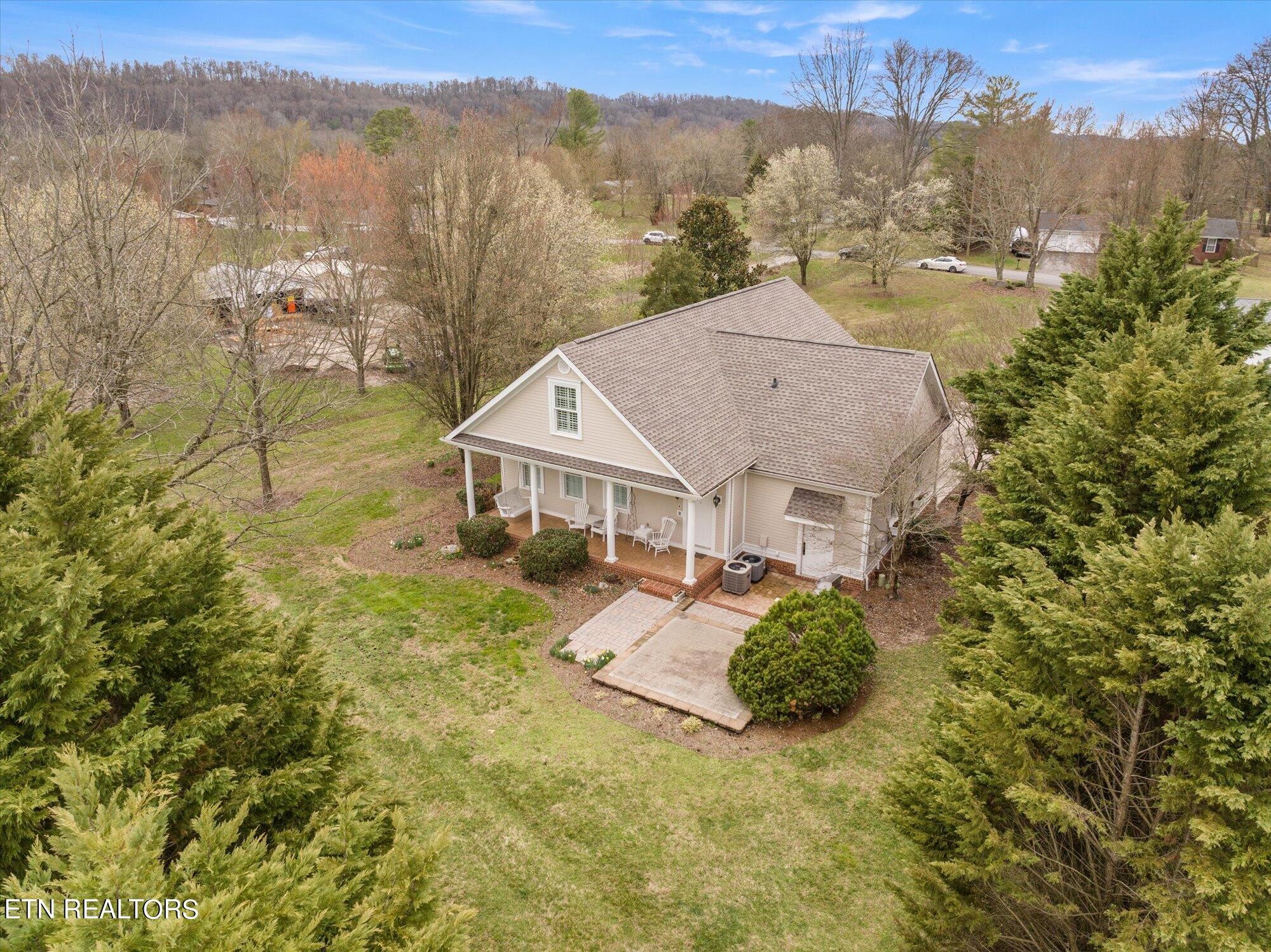7016 Castlewood Road Knoxville, TN 37931 - Photo 57 of 58 a view of a house with a big yard and large tree