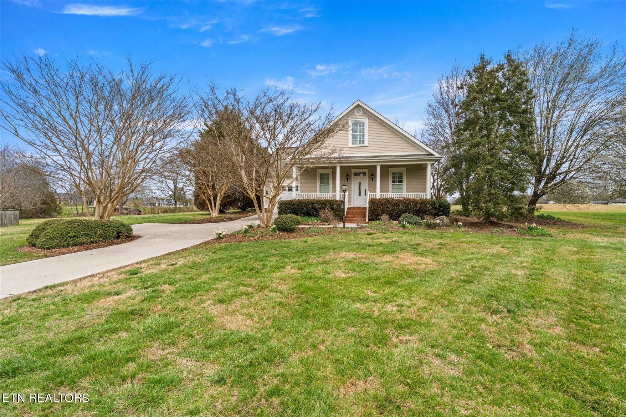 7016 Castlewood Road Knoxville, TN 37931 - Photo 7 of 58 a front view of a house with a yard and trees