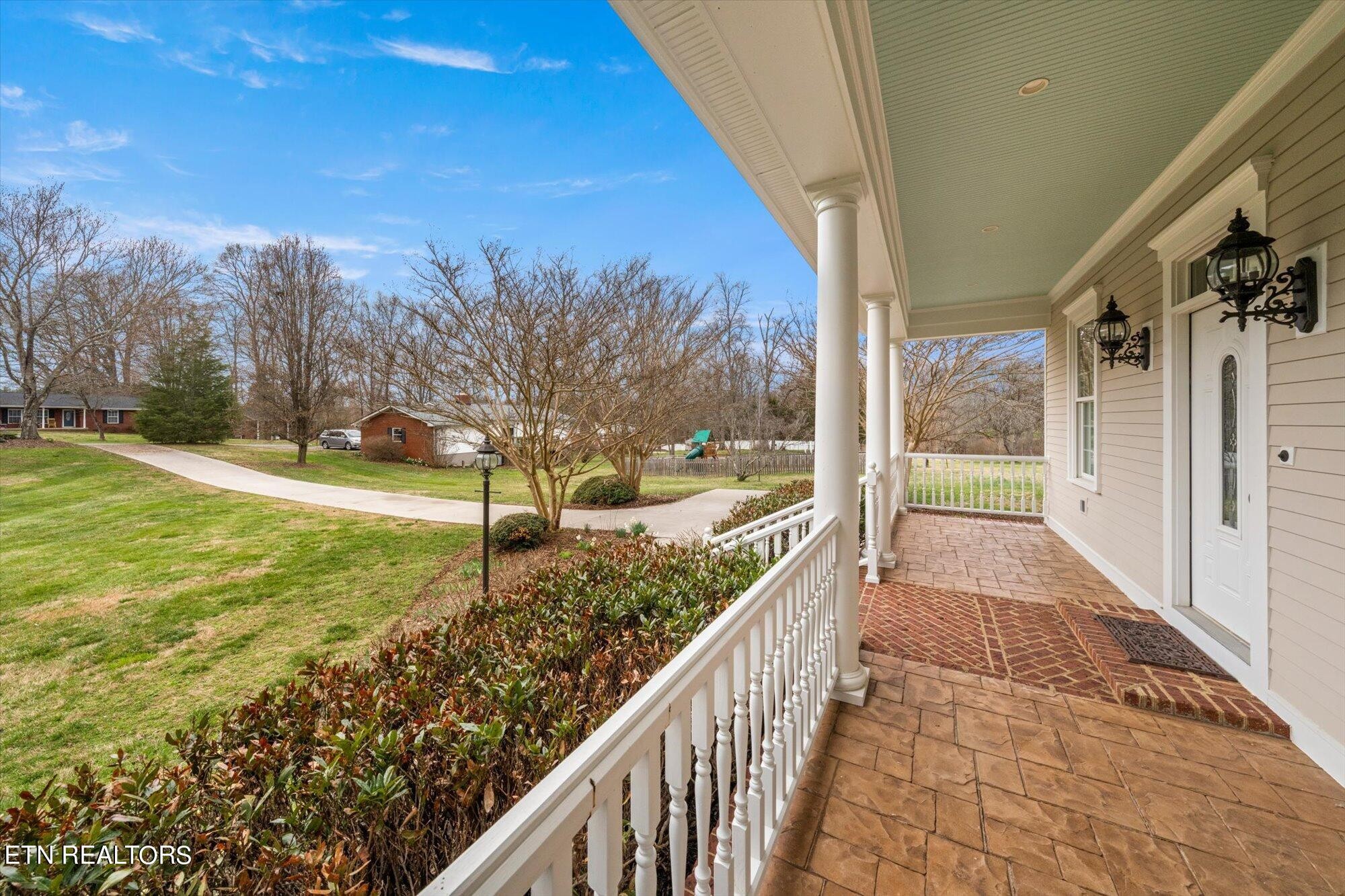 7016 Castlewood Road Knoxville, TN 37931 - Photo 8 of 58 a view of a pathway with a yard and balcony