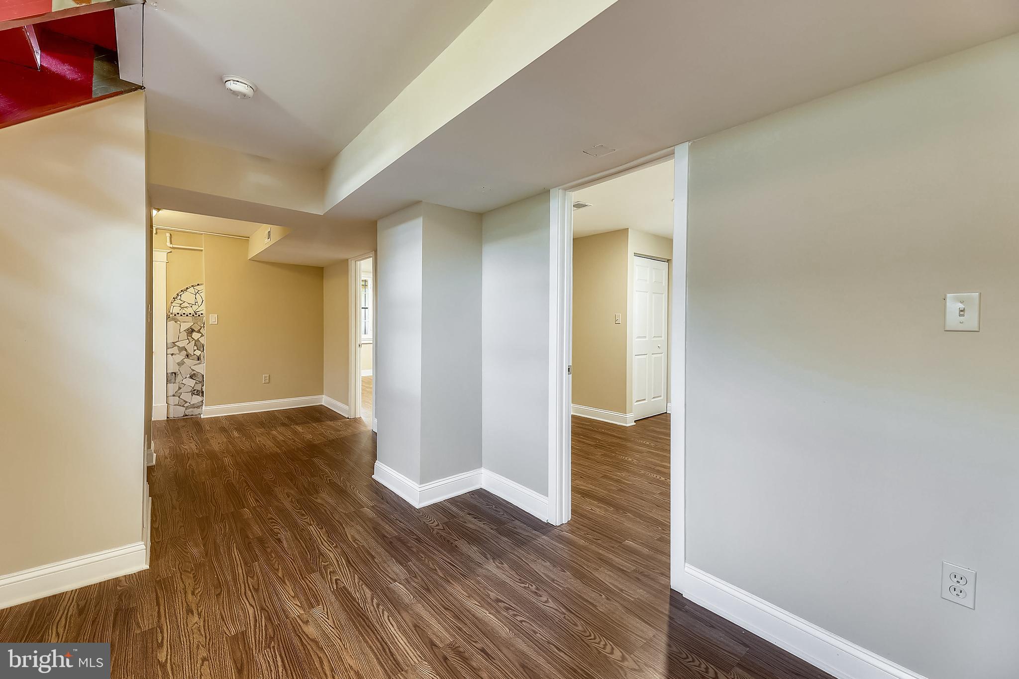 1321 Maple Avenue Baltimore, MD 21227 - Photo 13 of 30 a view of an empty room with wooden floor