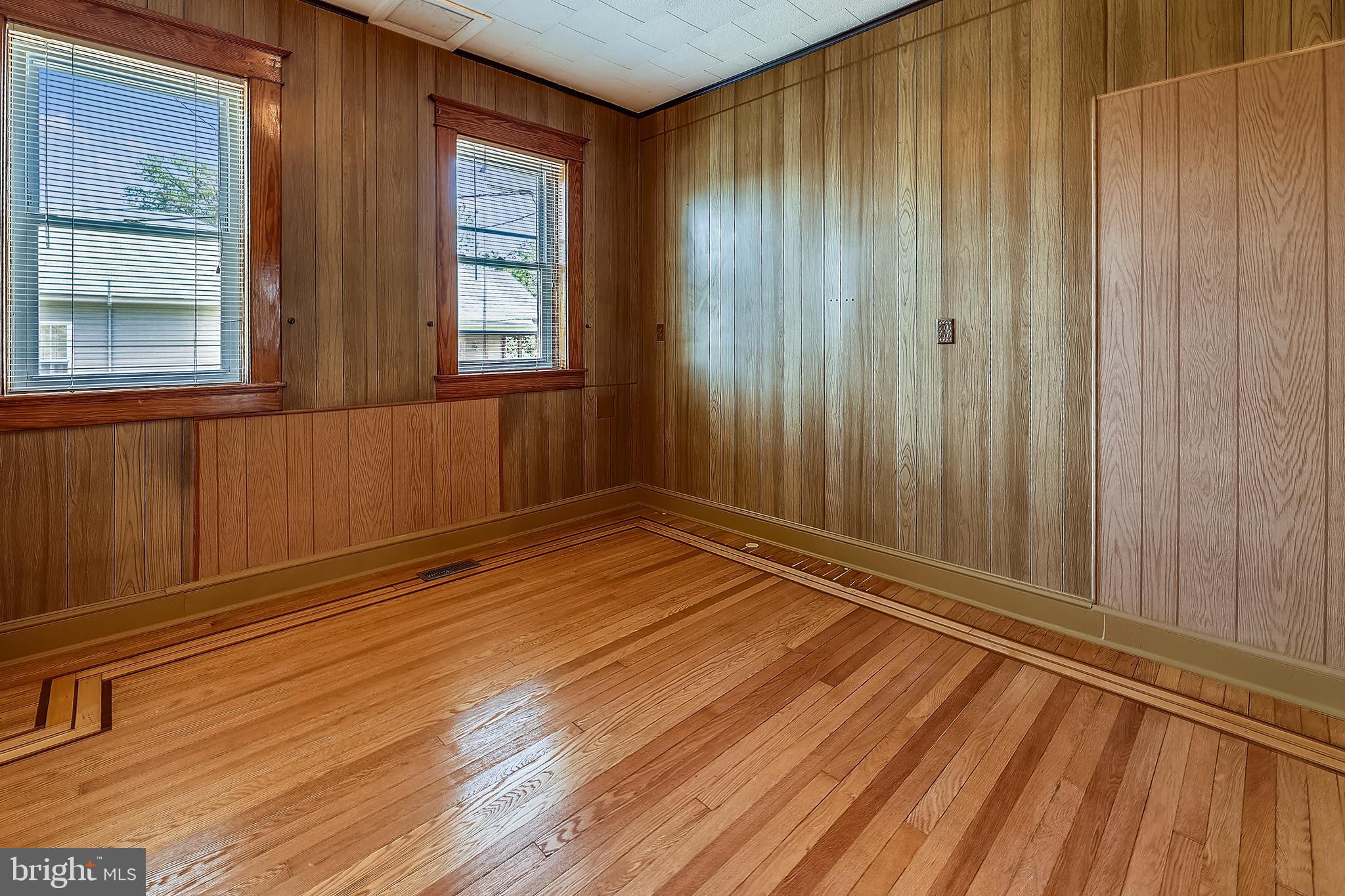 1321 Maple Avenue Baltimore, MD 21227 - Photo 15 of 30 a view of wooden floor and windows in a room