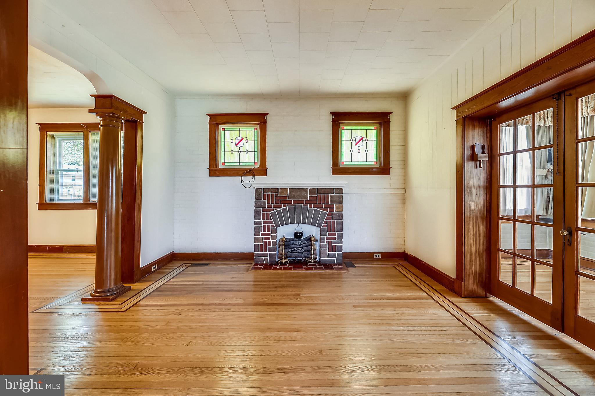 1321 Maple Avenue Baltimore, MD 21227 - Photo 18 of 30 a living room with furniture and a fireplace