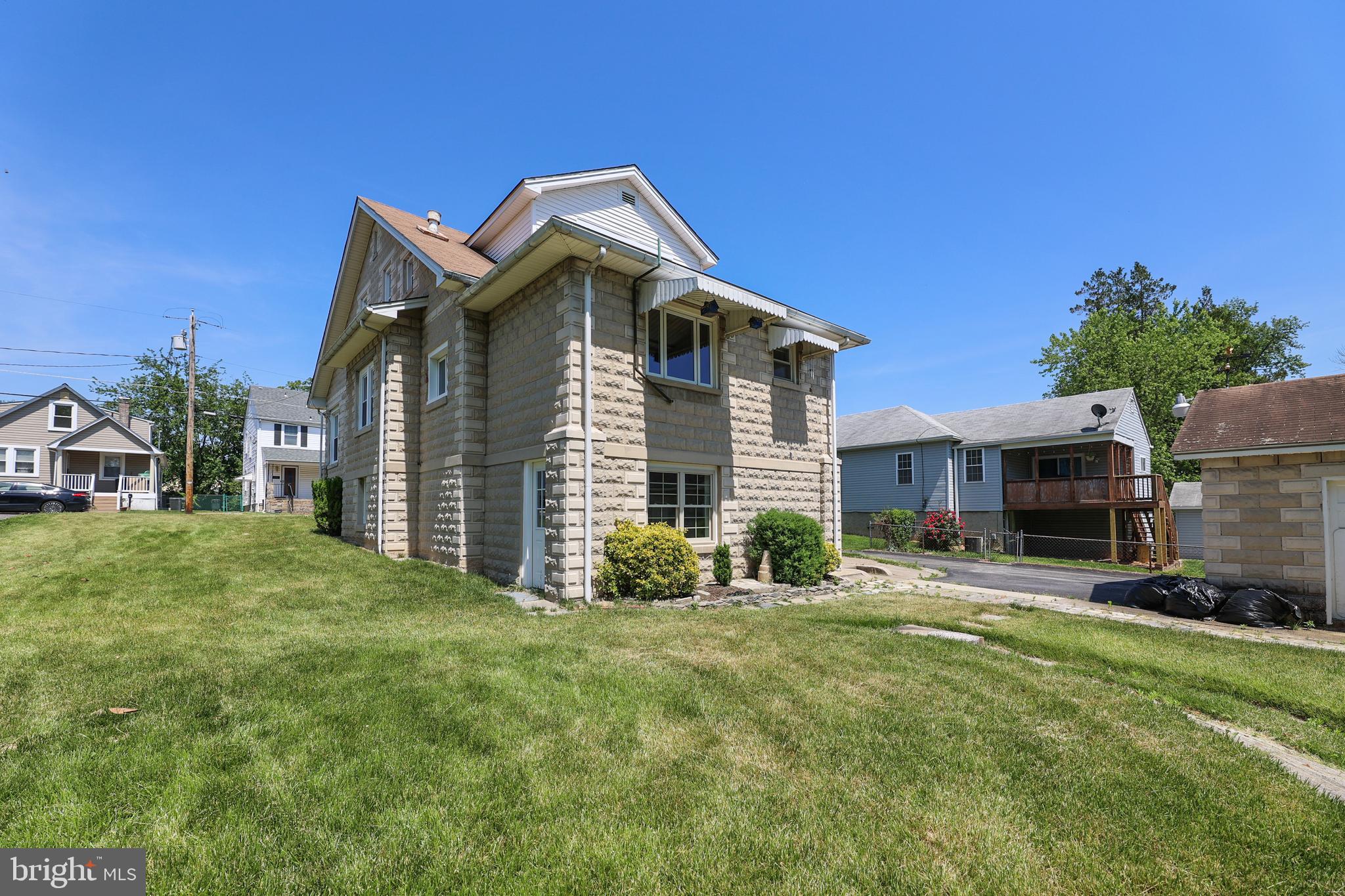 1321 Maple Avenue Baltimore, MD 21227 - Photo 2 of 30 a front view of a house with a yard