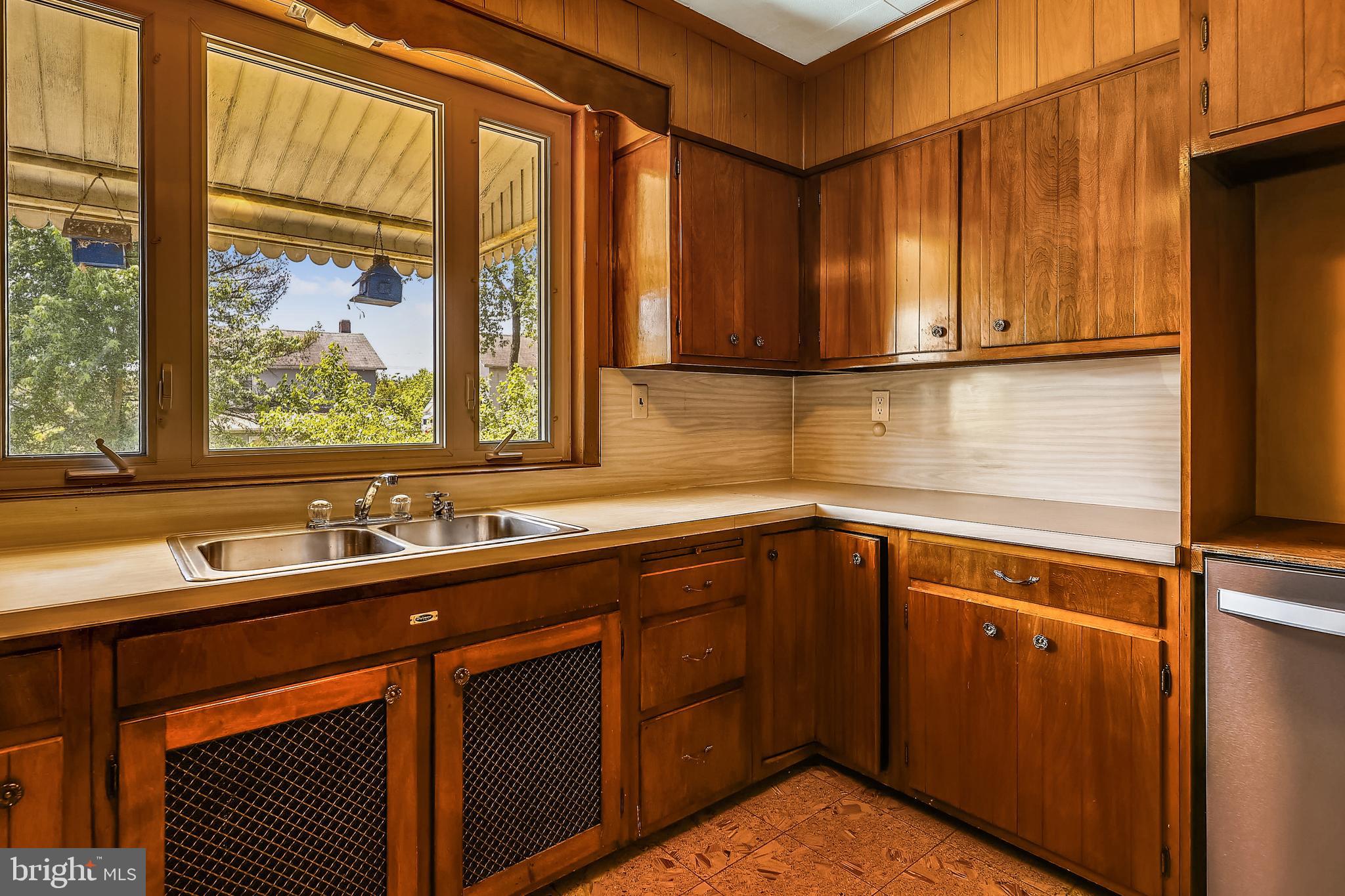 1321 Maple Avenue Baltimore, MD 21227 - Photo 21 of 30 a kitchen with a sink and a window