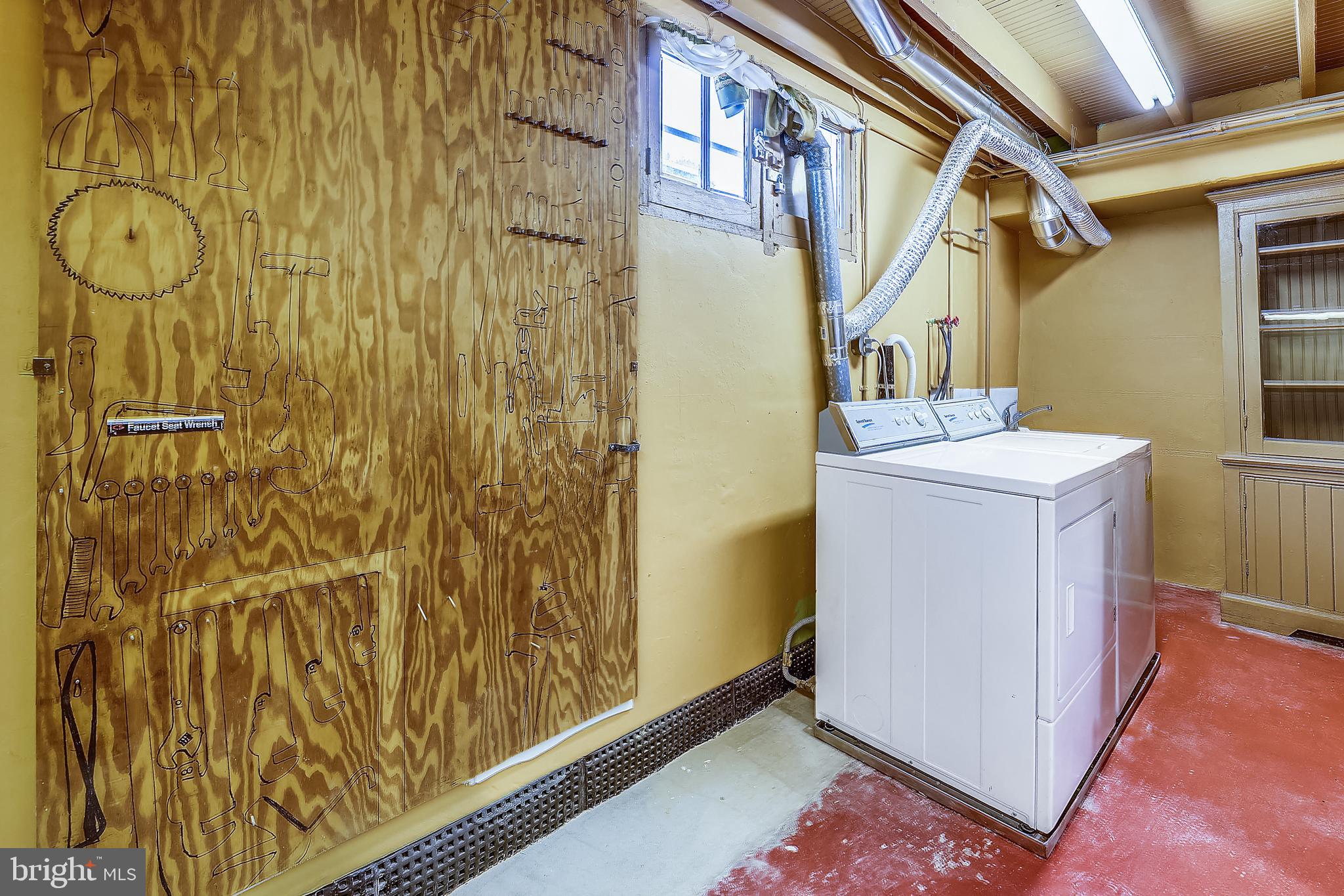 1321 Maple Avenue Baltimore, MD 21227 - Photo 30 of 30 a utility room with wooden floor washer and dryer