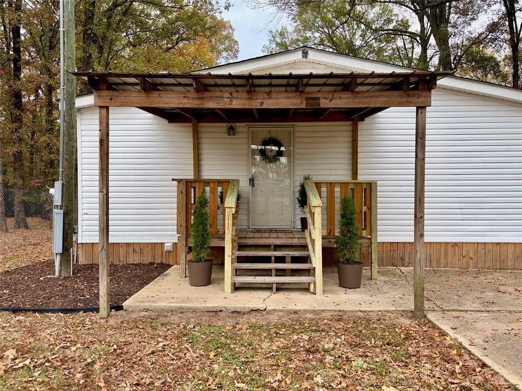 6913 Rice Road Shreveport, LA 71129 - Photo 2 of 26 a view of a house with a small yard and large tree