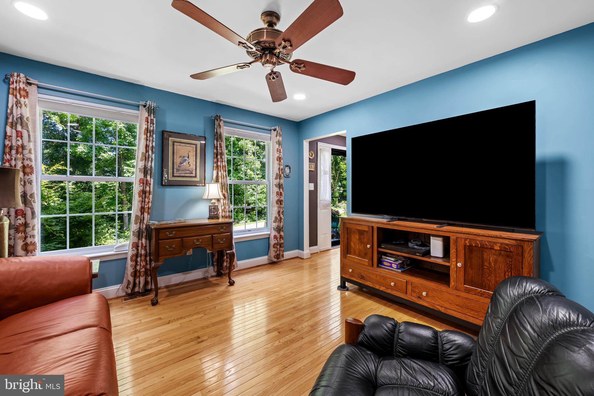 5026 Mt Carmel Road Hampstead, MD 21074 - Photo 8 of 57 a living room with furniture and a flat screen tv