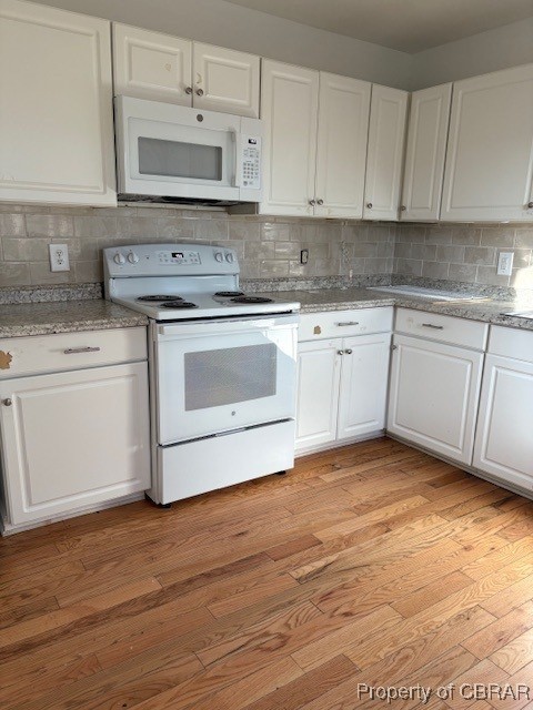 171 Lillys Neck Road Moon, VA 23119 - Photo 4 of 38 Kitchen with white cabinetry, tasteful backsplash, light wood-type flooring, and white appliances