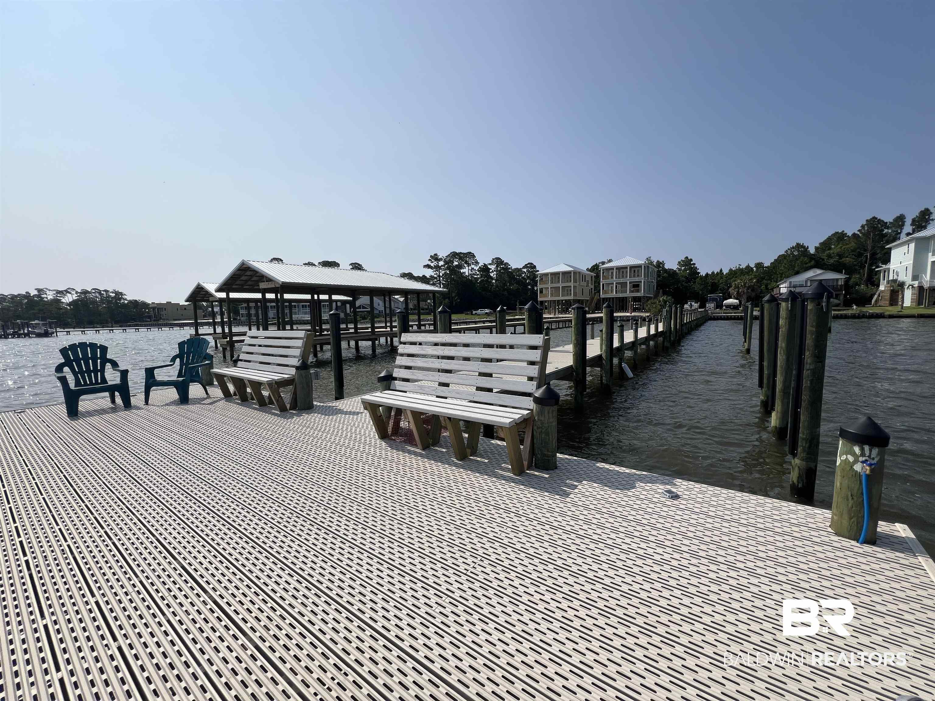 25957 Canal Road, Unit 203 Orange Beach, AL 36561 - Photo 2 of 28 Dock featuring a gazebo and a water view