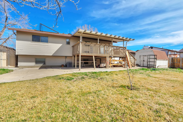 1057 North 700 West Clinton, UT 84015 - Photo 15 of 15 Back of house with a shed, a deck, and a patio
