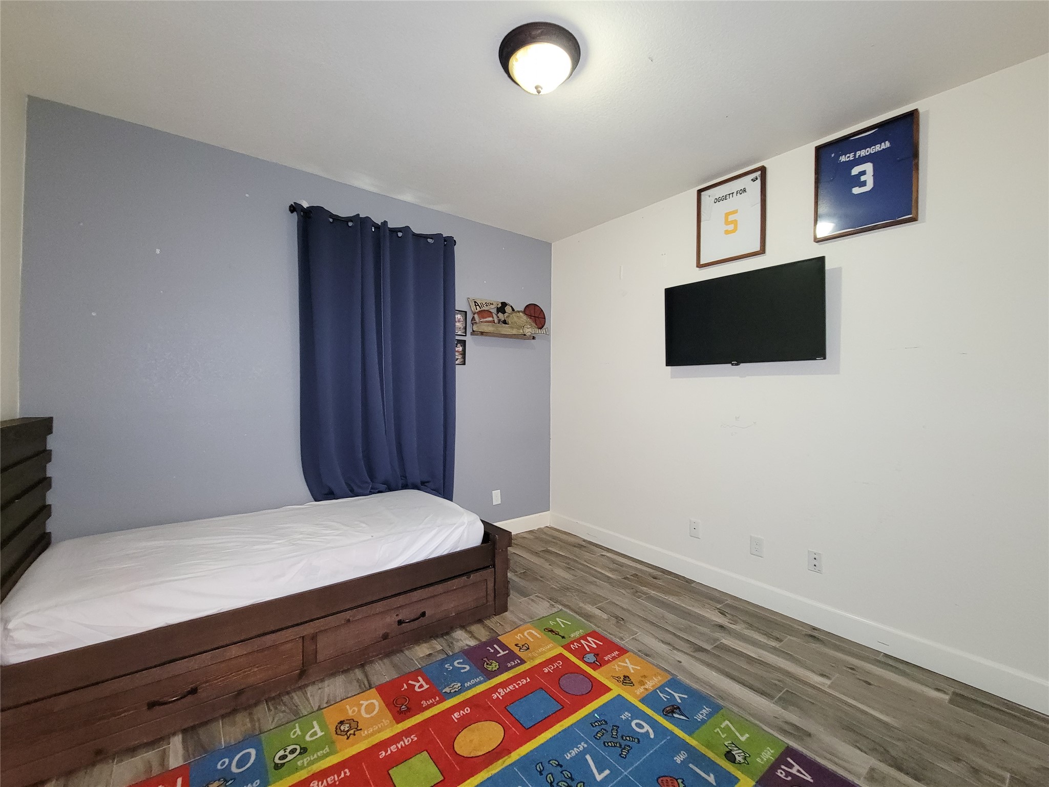 2011 Old Ox Road Spring, TX 77386 - Photo 28 of 38 a bedroom with a bed and a flat screen tv