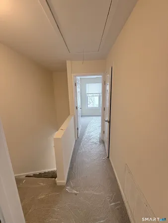 an empty room with windows and closet