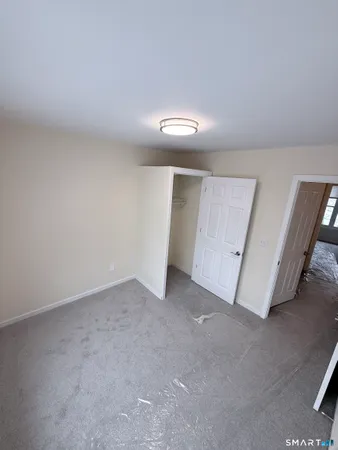 a view of a room with white walls