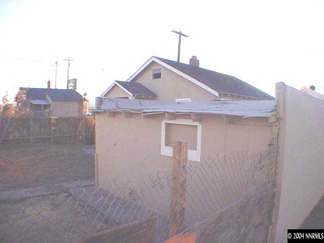 623 Quincy Street, Unit REAR ON ALLEY Reno, NV 89512 - Photo 3 of 3 a front view of a house with a yard