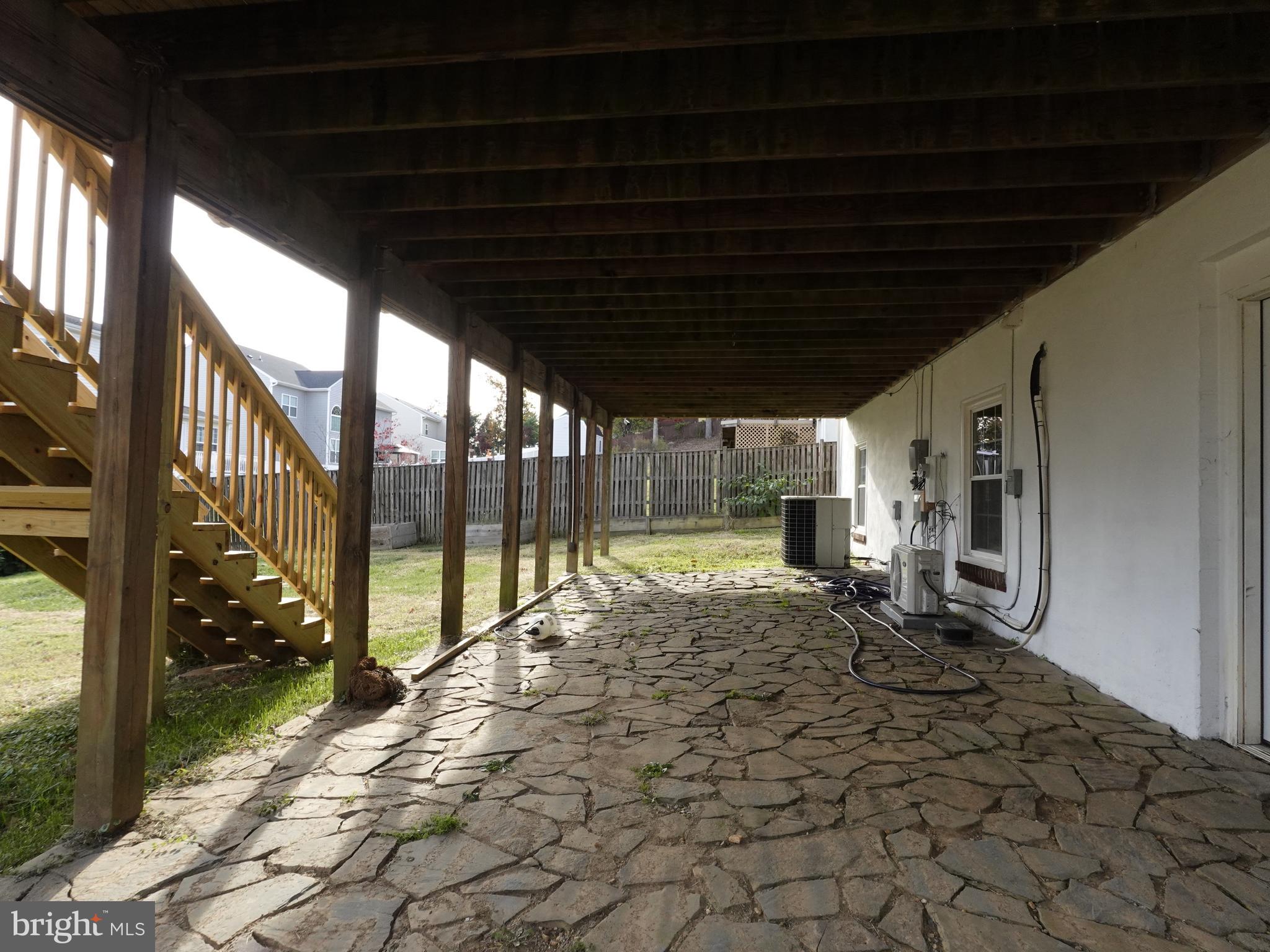 a view of a porch with wooden floor