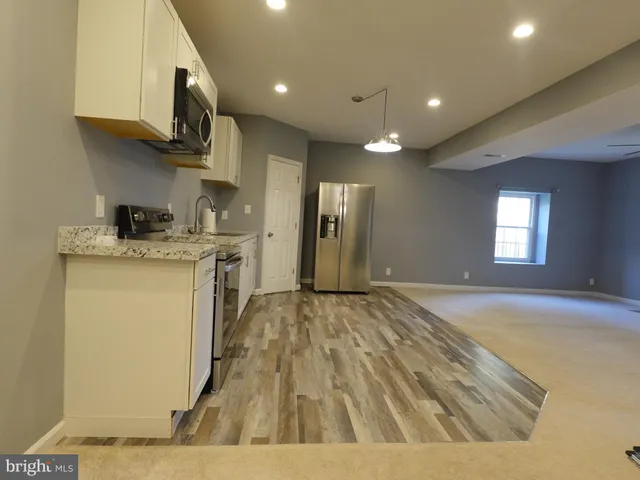 a view of a kitchen with a sink