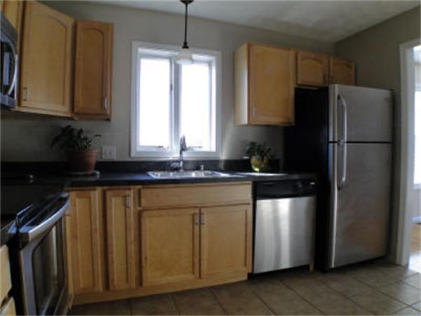 315 Ridge Road, Unit 2 Revere, MA 02151 - Photo 3 of 5 a kitchen with a refrigerator and a sink