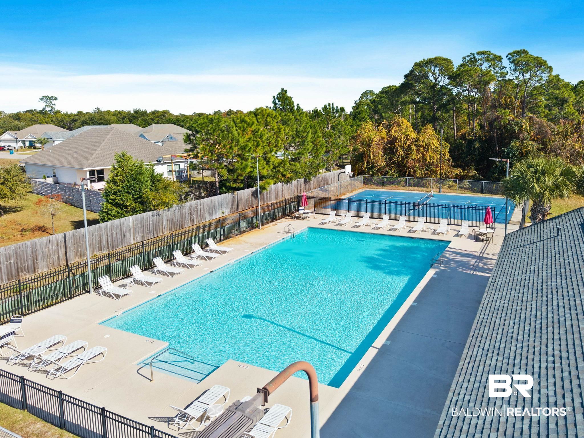 4143 Harbor Road Orange Beach, AL 36561 - Photo 33 of 33 Community pool featuring a patio area