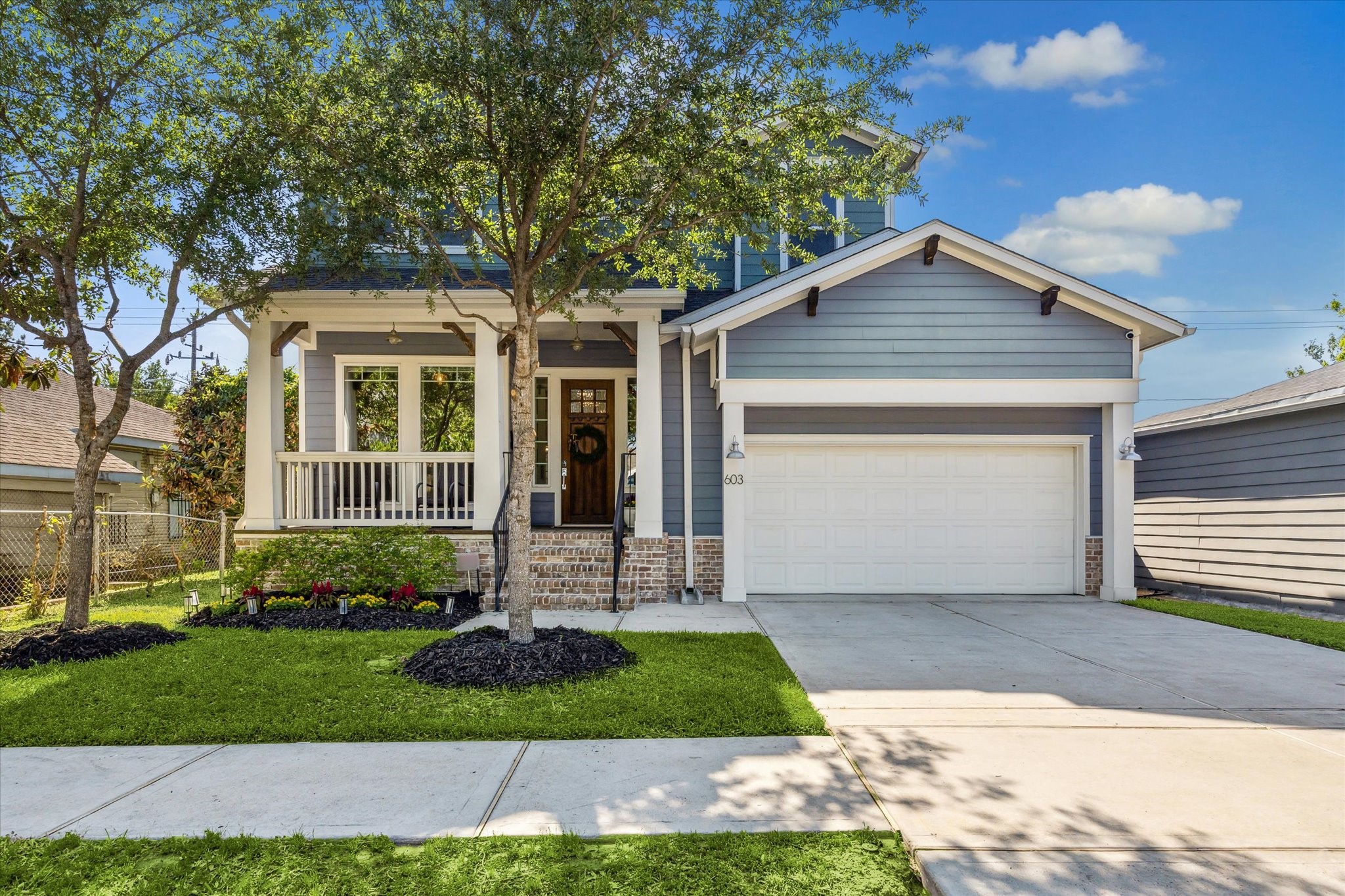 Welcome to 603 Vincent Street- This gorgeous custom built (2019) craftsman style home features a charming front facade + bricked steps leading to the covered porch + tasteful landscaping.