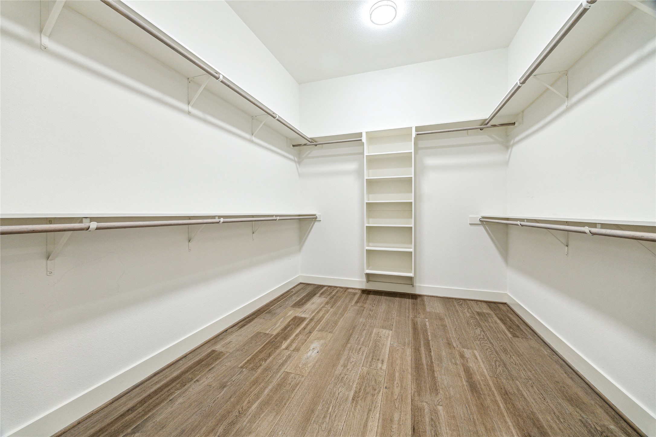 603 Vincent Street Houston, TX 77009 - Photo 13 of 26 Ample storage with shelving + hanging stations in this fantastic primary closet.